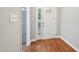 The entryway offers hardwood floors and a traditional white front door with sidelight windows at 103 Lakeway Ct, Cary, NC 27511