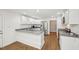 Open kitchen layout boasts granite countertops, stainless steel appliances, and lots of cabinet space at 103 Lakeway Ct, Cary, NC 27511