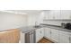 Bright kitchen with granite countertops, stainless steel appliances, and ample white cabinet space at 103 Lakeway Ct, Cary, NC 27511
