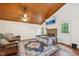 Cozy living room features a stone fireplace and wood-paneled vaulted ceilings at 103 Lakeway Ct, Cary, NC 27511