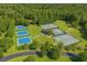 Aerial view of several tennis courts and shaded gazebo surrounded by lush trees in a park-like setting at 103 Lakeway Ct, Cary, NC 27511