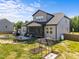 Beautiful backyard with a screened porch, outdoor kitchen, fire pit and garden at 105 Scotland Dr, Youngsville, NC 27596
