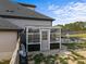 Backyard featuring a sunroom and an outdoor kitchen with a built in barbeque and a fire pit at 105 Scotland Dr, Youngsville, NC 27596
