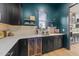 Elegant bar area with beverage cooler, sink, and modern countertops at 105 Scotland Dr, Youngsville, NC 27596