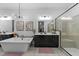 Spacious bathroom with a soaking tub, dual vanities with modern fixtures, and a glass-enclosed shower at 105 Scotland Dr, Youngsville, NC 27596