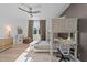 Cozy bedroom featuring a bunk bed with desk, a ceiling fan, and a window with natural light at 105 Scotland Dr, Youngsville, NC 27596