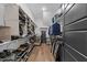 Walk-in closet with extensive shelving, hanging rods, and shoe racks, providing ample storage space at 105 Scotland Dr, Youngsville, NC 27596