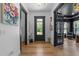 Hallway with wood flooring, accent walls, natural light and modern decor at 105 Scotland Dr, Youngsville, NC 27596