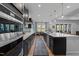 Large kitchen featuring stainless steel appliances, an island with bar seating, and backyard view at 105 Scotland Dr, Youngsville, NC 27596