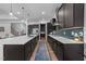 Open kitchen with a large island, modern appliances, and hardwood floors at 105 Scotland Dr, Youngsville, NC 27596