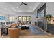 Open living room with a fireplace, comfortable seating, and sliding glass doors to the patio at 105 Scotland Dr, Youngsville, NC 27596