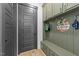 Mudroom with built-in storage, a bench, and wood-look flooring at 105 Scotland Dr, Youngsville, NC 27596