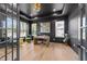 Sophisticated office with dark walls, tray ceiling, modern desk, and natural light at 105 Scotland Dr, Youngsville, NC 27596