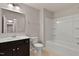 Full bathroom with combined tub and shower, vanity with drawers, and large mirror at 107 Explorer Dr, Morrisville, NC 27560