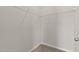 Walk-in closet with wire shelving installed and carpeted floors in a home interior at 107 Explorer Dr, Morrisville, NC 27560