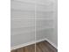 Walk-in closet with wire shelving and wood-look flooring at 107 Explorer Dr, Morrisville, NC 27560