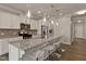 Bright kitchen featuring granite counters, stainless appliances, and a large island with seating at 107 Explorer Dr, Morrisville, NC 27560