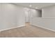 An open loft area with neutral walls and carpet and a door leading to another area at 107 Explorer Dr, Morrisville, NC 27560