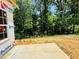 Concrete pad next to an lot with trees at 1087 Fairhaven Dr # 48, Mebane, NC 27302