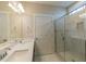 Bathroom featuring a double sink vanity, quartz countertop, and a walk-in shower with tile surround at 1087 Fairhaven Dr # 48, Mebane, NC 27302