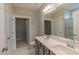 Bathroom featuring double sinks, a large mirror, tile floors, and a walk-in closet at 1087 Fairhaven Dr # 48, Mebane, NC 27302