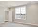Bright bedroom with carpet, neutral walls, crown molding, and a large window offering pleasant views at 1087 Fairhaven Dr # 48, Mebane, NC 27302