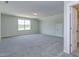 Expansive bonus room with carpet, a window, and a door, offering versatile space at 1087 Fairhaven Dr # 48, Mebane, NC 27302