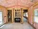 An interior view reveals the construction with a fireplace, insulation, and the layout of the house at 1087 Fairhaven Dr # 48, Mebane, NC 27302