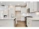 Modern kitchen featuring white cabinets, stainless steel appliances, and a granite countertop island at 1087 Fairhaven Dr # 48, Mebane, NC 27302