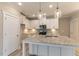 Bright kitchen featuring white cabinets, granite countertops, and stainless steel appliances under recessed lighting at 1087 Fairhaven Dr # 48, Mebane, NC 27302