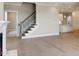 Open living area with fireplace and staircase, blending modern design with comfortable living space at 1087 Fairhaven Dr # 48, Mebane, NC 27302