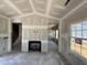 Open floorplan room with a fireplace, and many windows, awaiting transformation into an elegant living space at 1087 Fairhaven Dr # 48, Mebane, NC 27302