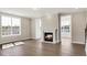 Bright living room featuring a fireplace, beautiful hardwood floors and plenty of natural light at 1087 Fairhaven Dr # 48, Mebane, NC 27302