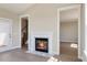 Cozy living room with a fireplace, white trim, and natural light streaming through the windows at 1087 Fairhaven Dr # 48, Mebane, NC 27302