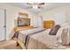 This carpeted bedroom features neutral walls, light-colored wooden furniture, and an open doorway to another room at 109 Grange Dr, Wendell, NC 27591