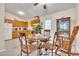 Cozy dining area featuring hardwood floors, a round table, and ample natural light at 109 Grange Dr, Wendell, NC 27591