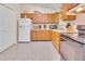 Functional kitchen with wood cabinets, essential appliances, and a bright atmosphere at 109 Grange Dr, Wendell, NC 27591