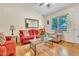 Comfortable living room showcasing hardwood flooring, a large window, and stylish furniture at 109 Grange Dr, Wendell, NC 27591