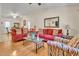Bright and airy living room with hardwood floors, comfortable seating, and dining area access at 109 Grange Dr, Wendell, NC 27591