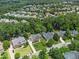 Aerial shot of a residential area with mature trees and well-kept lawns at 112 Sterling Ridge Way, Cary, NC 27519