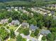 Aerial view showcases a neighborhood with mature trees and well-maintained homes at 112 Sterling Ridge Way, Cary, NC 27519