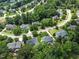Beautiful aerial view of a neighborhood with lush green trees and well-maintained homes at 112 Sterling Ridge Way, Cary, NC 27519