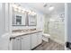 Bright bathroom featuring a double vanity, glass enclosed shower and granite countertop at 112 Sterling Ridge Way, Cary, NC 27519