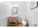Charming half bathroom with subway tile and a wood vanity at 112 Sterling Ridge Way, Cary, NC 27519