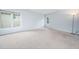 Empty bedroom featuring light blue walls, light neutral carpet and windows at 112 Sterling Ridge Way, Cary, NC 27519