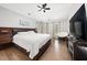 Main bedroom suite with ceiling fan and large bed at 112 Sterling Ridge Way, Cary, NC 27519
