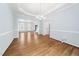 Spacious dining room with hardwood floors and a modern chandelier at 112 Sterling Ridge Way, Cary, NC 27519