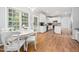 Eat-in kitchen area with white table and chairs, with stainless steel appliances at 112 Sterling Ridge Way, Cary, NC 27519
