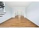 Bright, airy living room with hardwood floors, freshly painted walls, and views of adjacent rooms at 112 Sterling Ridge Way, Cary, NC 27519