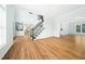 Spacious living room with hardwood floors, staircase, and a view into multiple rooms at 112 Sterling Ridge Way, Cary, NC 27519